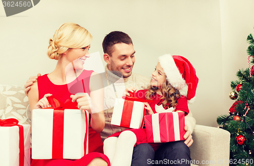 Image of happy family opening gift boxes