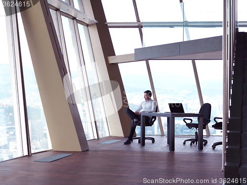 Image of young business man at office