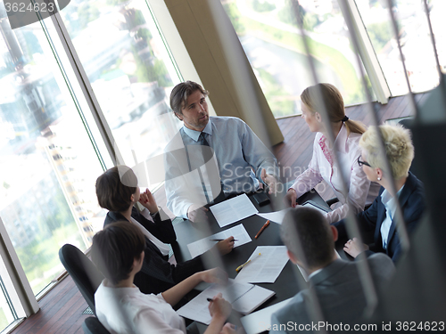 Image of business people group on meeting at bright modern office