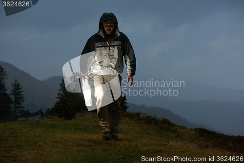 Image of advanture man with backpack hiking