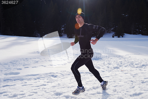 Image of jogging on snow in forest