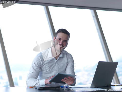 Image of young business man at office