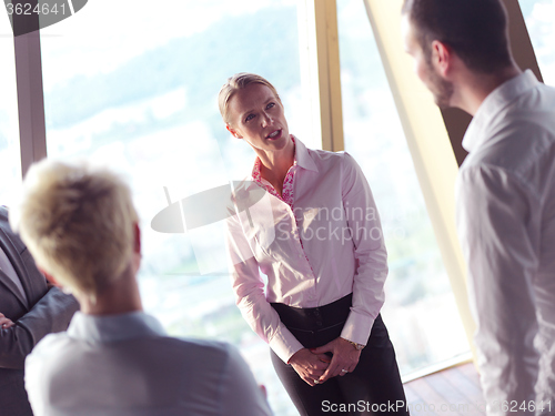 Image of business people group on meeting at bright modern office