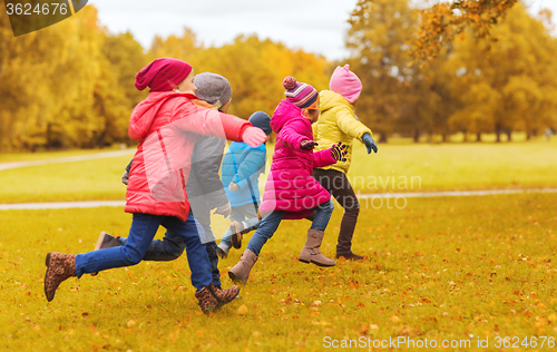 Image of group of happy little kids running outdoors