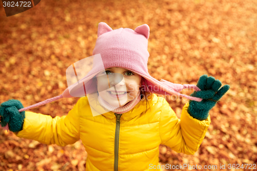 Image of happy little girl in autumn park