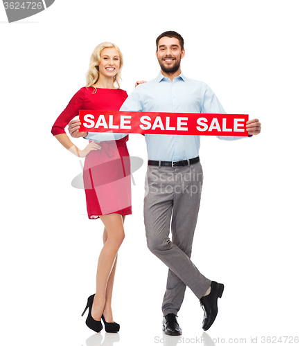 Image of happy couple with red sale sign