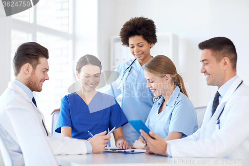 Image of group of happy doctors meeting at hospital office