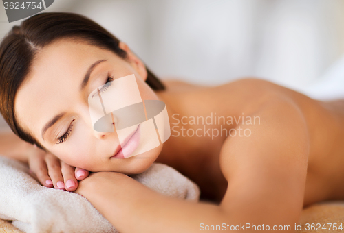 Image of beautiful woman with closed eyes in spa