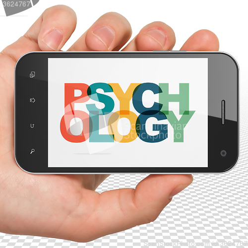 Image of Healthcare concept: Hand Holding Smartphone with Psychology on  display