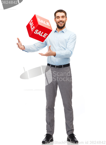 Image of smiling man with red shopping bag