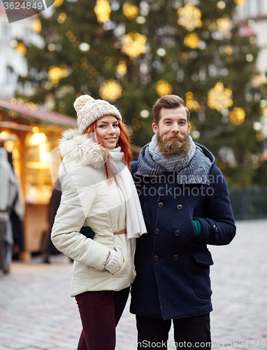 Image of happy couple walking in old town