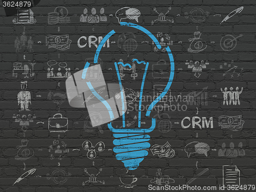 Image of Business concept: Light Bulb on wall background