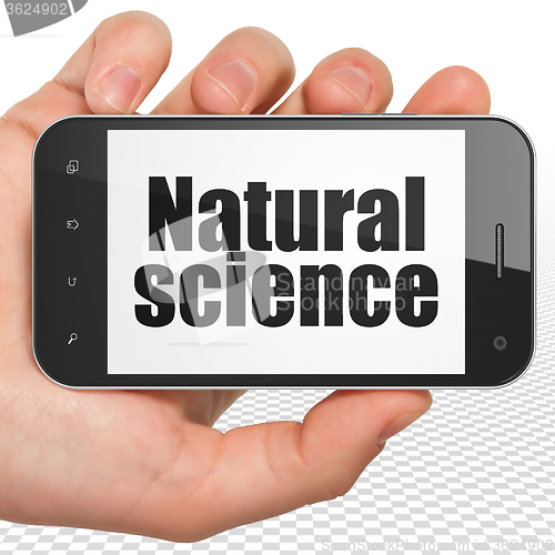 Image of Science concept: Hand Holding Smartphone with Natural Science on display