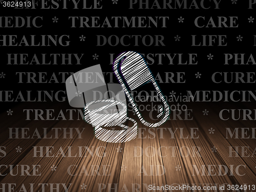 Image of Medicine concept: Pills in grunge dark room