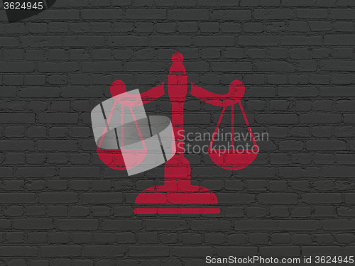 Image of Law concept: Scales on wall background