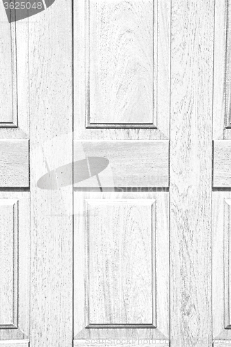 Image of abstract texture of a brown antique wooden old door in italy   e