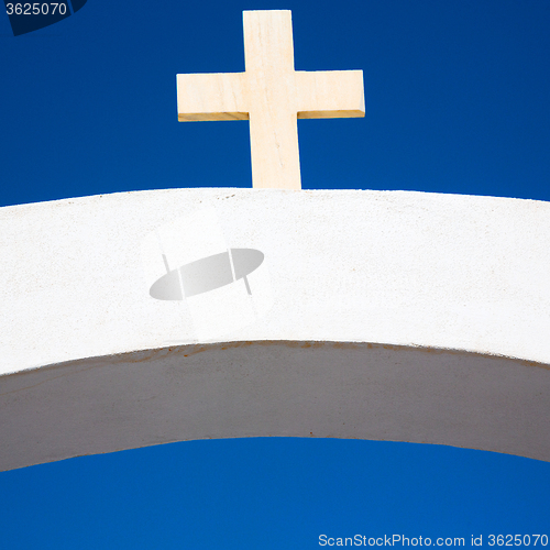 Image of in europe greece a cross the cloudy sky