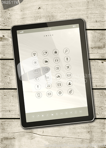 Image of Digital tablet PC on a white wood table