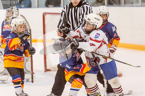 Image of Fighting players of children hockey