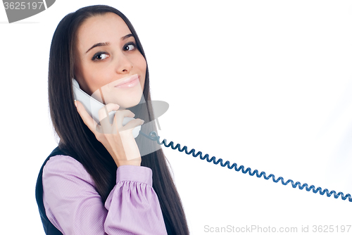 Image of Attractive woman answering phone and smiling