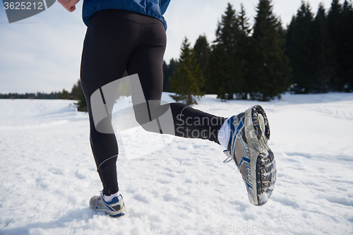 Image of jogging on snow in forest