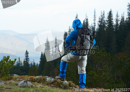 Image of advanture man with backpack hiking