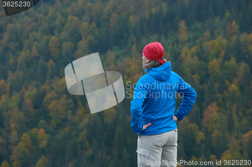 Image of advanture man with backpack hiking