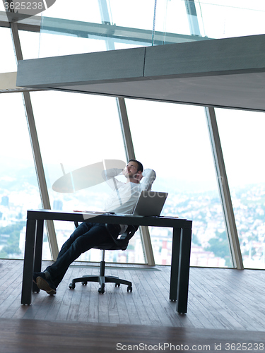 Image of young business man at office