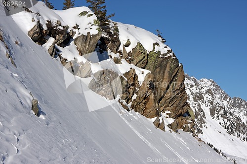 Image of Boulders on snowy mountain