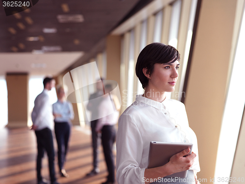Image of business people group standing together