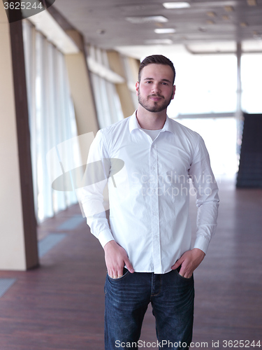 Image of portrait of young  business man with beard at modern office