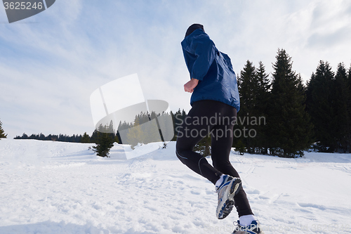 Image of jogging on snow in forest