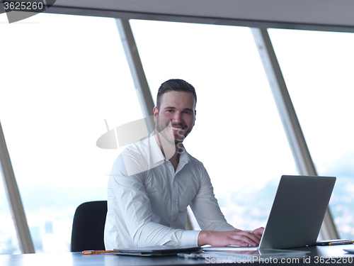 Image of young business man at office