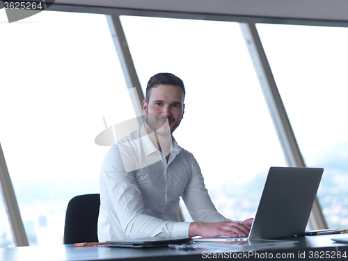 Image of young business man at office