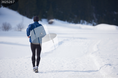 Image of jogging on snow in forest