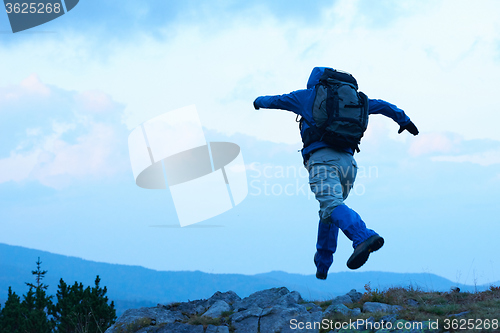 Image of advanture man with backpack hiking