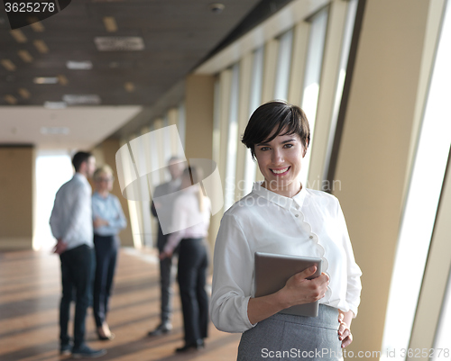 Image of business people group standing together