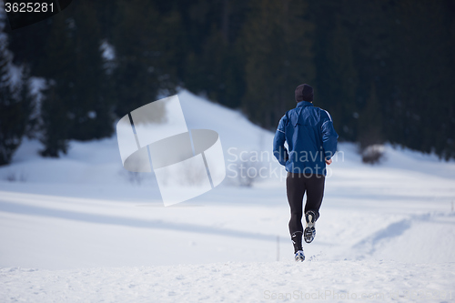 Image of jogging on snow in forest