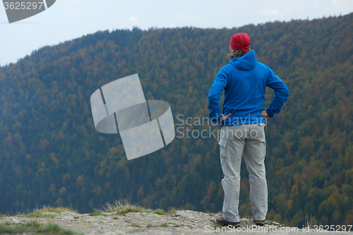 Image of advanture man with backpack hiking