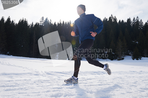 Image of jogging on snow in forest