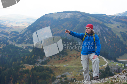 Image of advanture man with backpack hiking