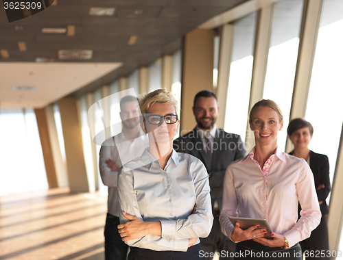 Image of business people group standing together