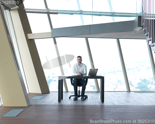 Image of young business man at office