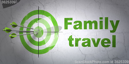 Image of Travel concept: target and Family Travel on wall background