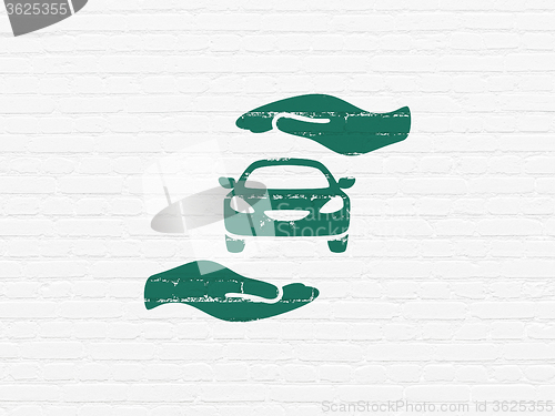 Image of Insurance concept: Car And Palm on wall background