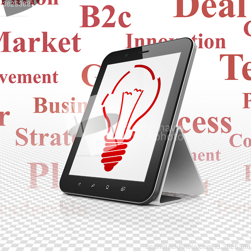 Image of Business concept: Tablet Computer with Light Bulb on display