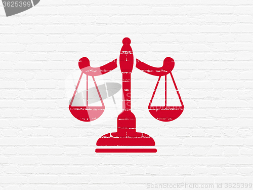Image of Law concept: Scales on wall background