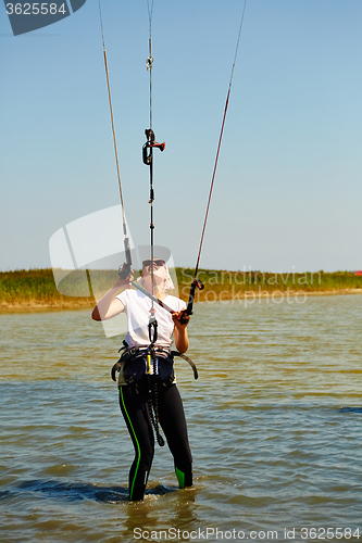 Image of young woman kite-surfer