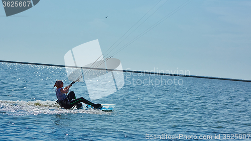 Image of young woman kite-surfer