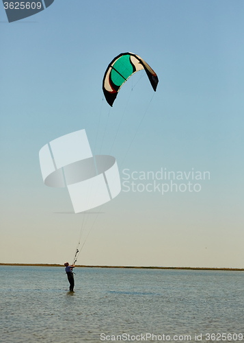 Image of young woman kite-surfer